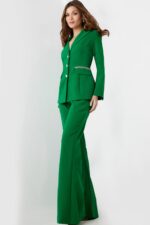 Model wearing Jovani 26144 green pantsuit with deep V-neck.