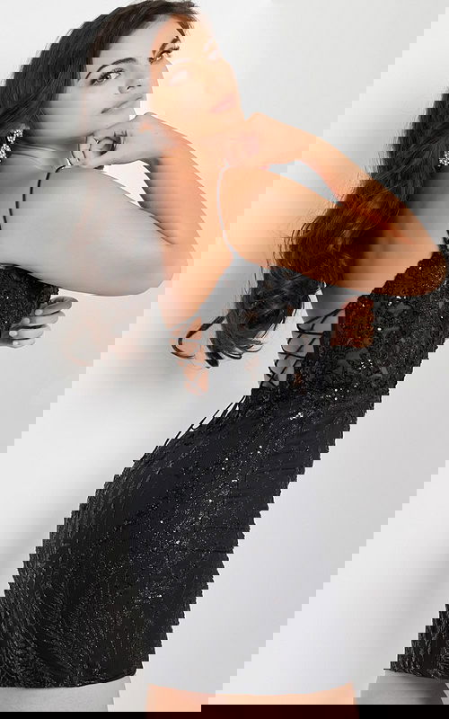 Model wearing Jovani 26183 black mini dress with lace-up back, back view