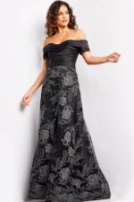 Model wearing Jovani 26186 elegant black gown, back view with floral embroidery.