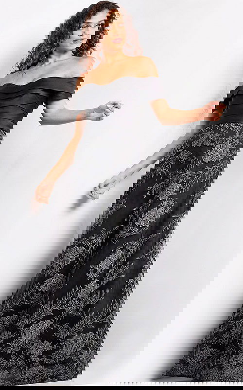 Model wearing Jovani 26186 elegant black gown, back view with floral embroidery.