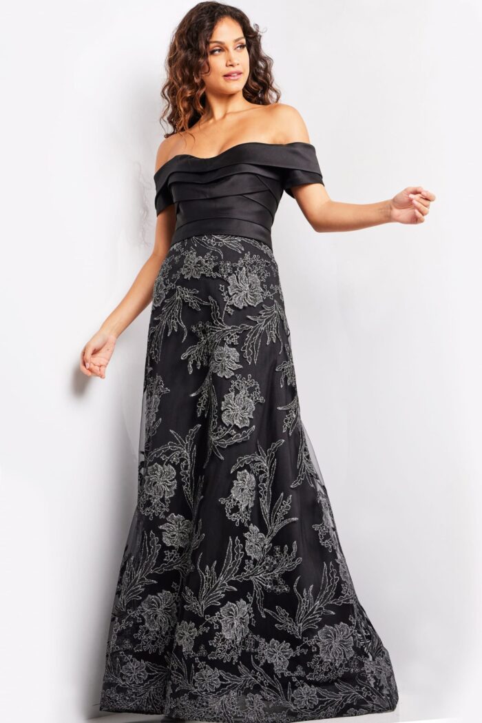 Model wearing Jovani 26186 elegant black gown, back view with floral embroidery.