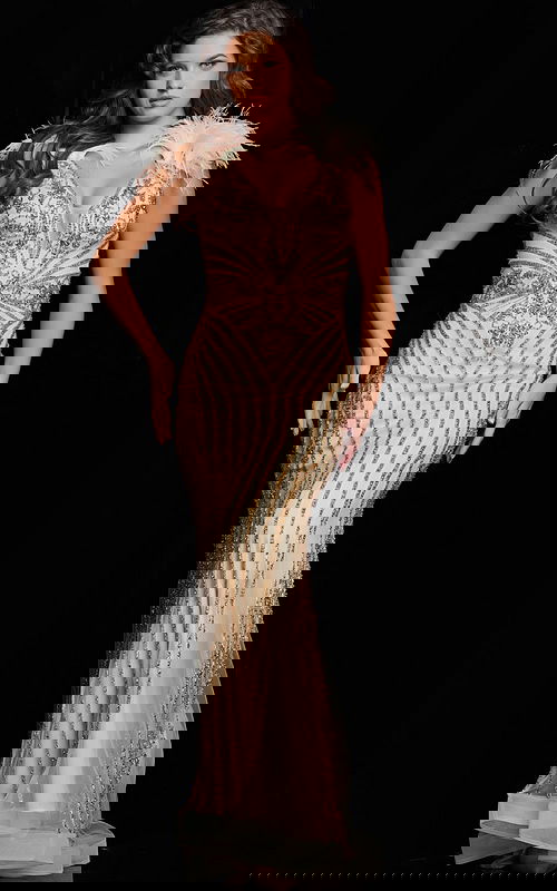 Model wearing Jovani 26224 gold gown with beadwork and feathers, front view.