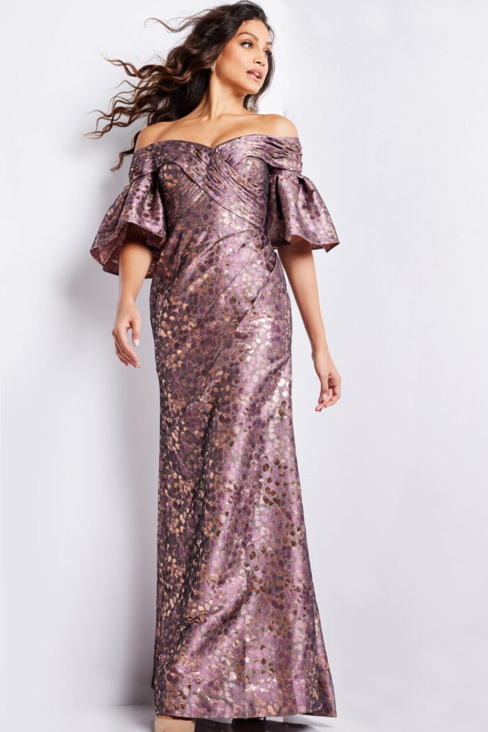 Model wearing Jovani 26258 gold dress showing off-the-shoulder neckline and mermaid silhouette.
