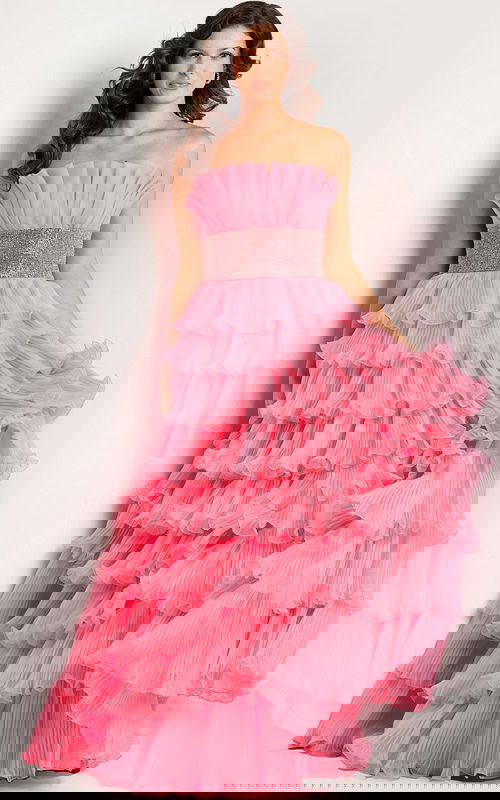 Model wearing Jovani 26314 pink gown with tiered ruffles, front view.