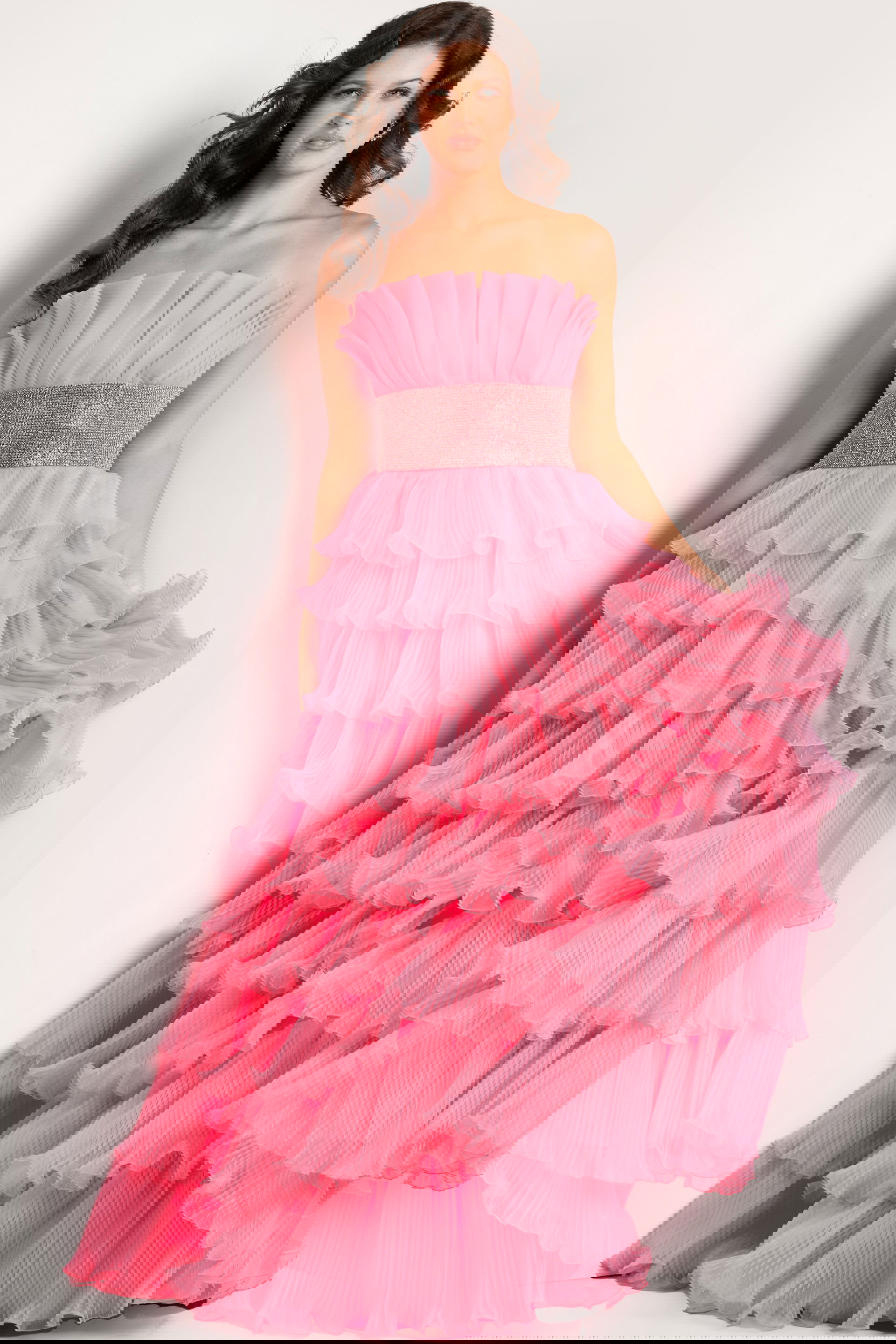 26314.jpg Model wearing Jovani 26314 pink gown with tiered ruffles, front view.