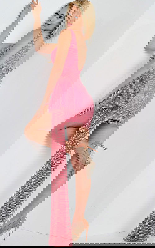 Back view of model wearing Jovani 26319 hot pink mini dress showcasing dramatic side accent.