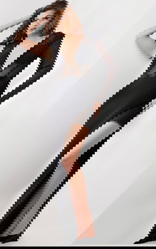 Model wearing Jovani 26333 black dress with V-neckline and high slit.