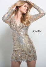 Model wearing Jovani 27205 Long Sleeve V Neck Embellished Short Dress