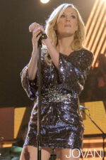 Model wearing Carrie Underwood in Jovani 158975