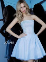Front view of model with hands on hips wearing Jovani K2830 light blue dress.