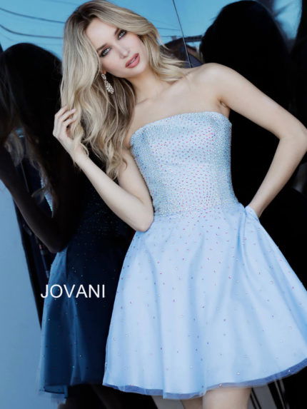 Front view of model wearing Jovani K2830 light blue dress with embellishments.