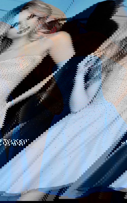 Front view of model wearing Jovani K2830 light blue dress with embellishments.