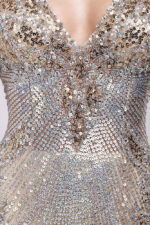 Model wearing Jovani 27205 Long Sleeve V Neck Embellished Short Dress