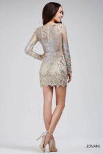 Model wearing Jovani 27205 Long Sleeve V Neck Embellished Short Dress
