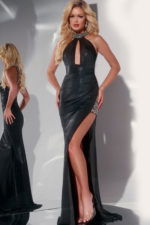 Model wearing Jovani 29496 black dress with halter neckline and high slit, front view.