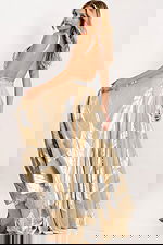 Flowing gold halter dress with crossover neckline