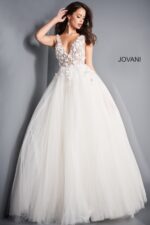 Model wearing Jovani 3110 ivory gown with floral applique and deep V-neckline, front view.