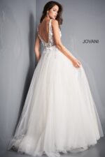 Model wearing Jovani 3110 ivory gown, highlighting the deep V-back design.