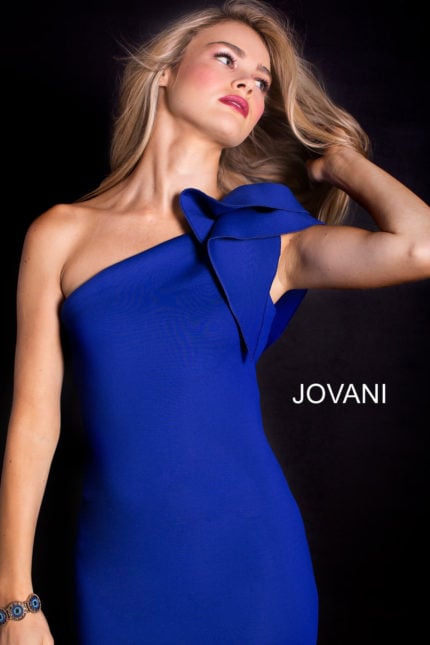 Model wearing Jovani 32602 royal blue gown with one-shoulder bow detail