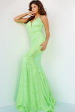 Model posing in Jovani 3263 neon green gown with floral sequins