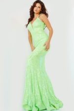 Model wearing Jovani 3263 neon green mermaid gown with a V-neckline