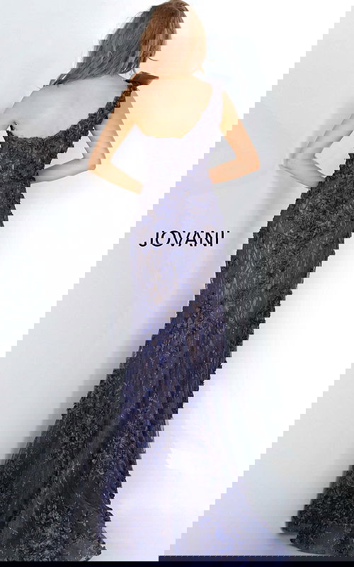 Model wearing Jovani 3375 navy evening gown with floral lace and mermaid silhouette, back view.