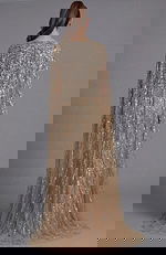 Back view of a beaded gown with flowing cape sleeves and fitted column silhouette