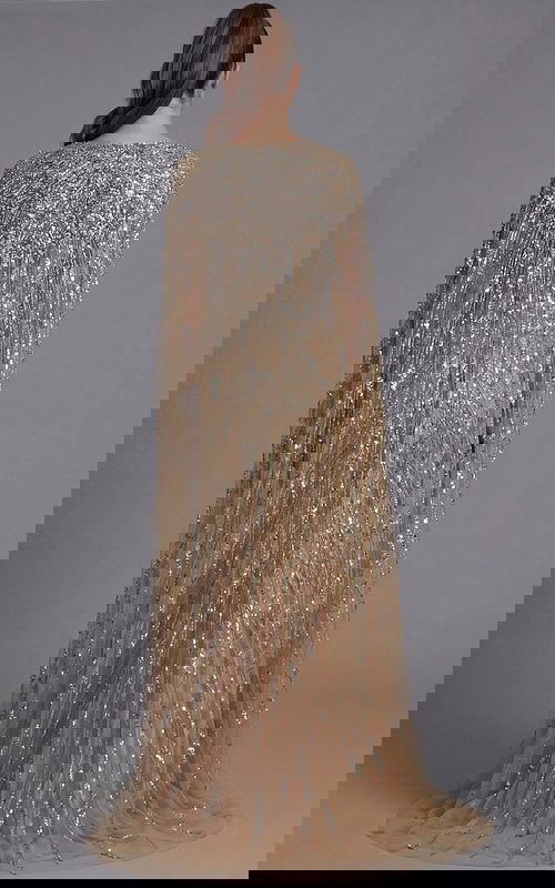 Back view of a beaded gown with flowing cape sleeves and fitted column silhouette