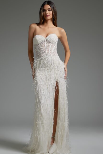 Model in Jovani 36362 white gown, showcasing front view with high slit.