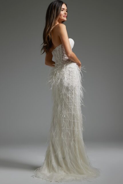 Back view of model wearing Jovani 36362 elegant white gown with lace details.