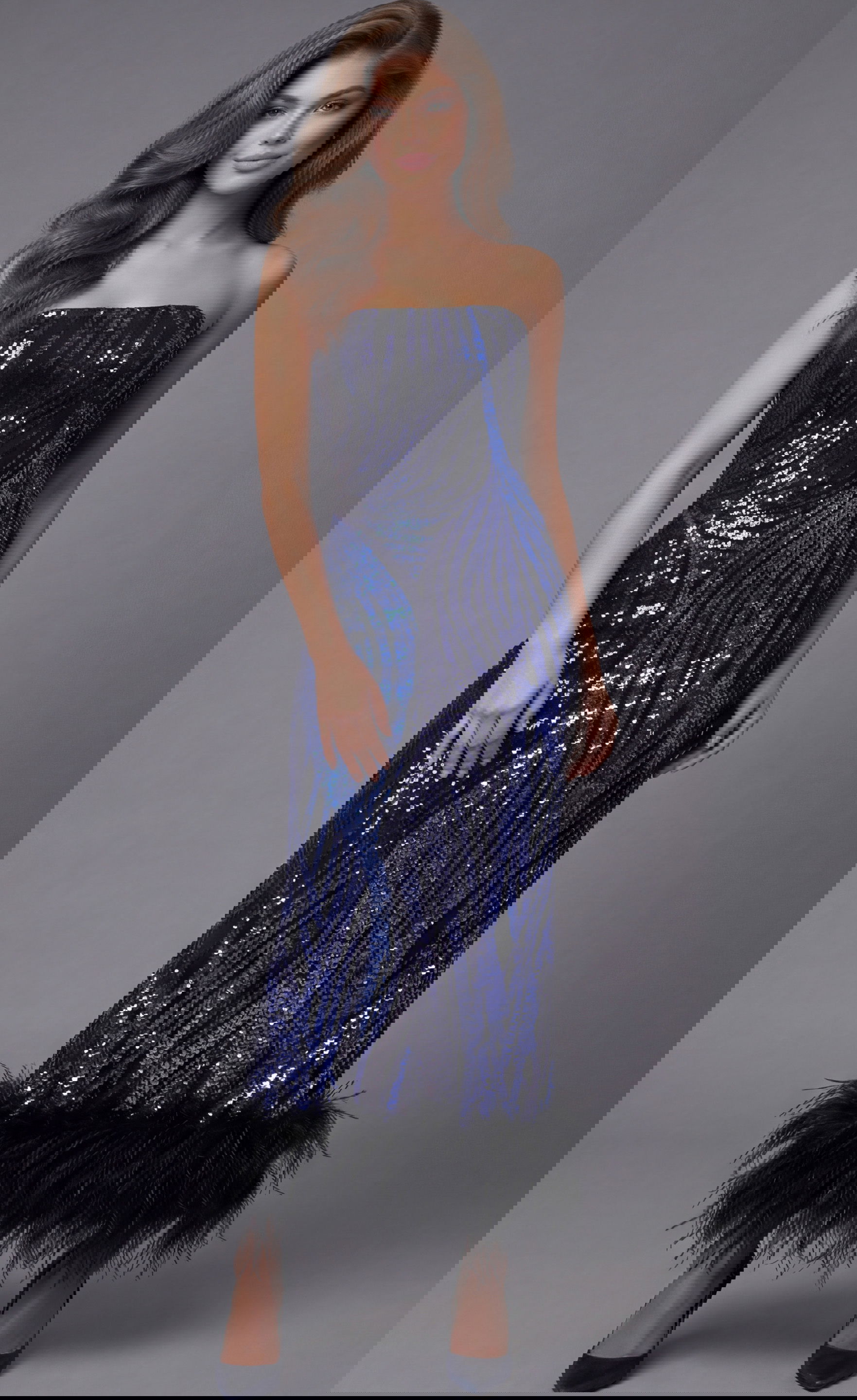 36376-1 Jovani 36376 navy blue strapless ankle-length sequin dress featuring allover swirling wave sequin pattern in royal blue and gunmetal tones with black ostrich feather trim along the bottom hem.