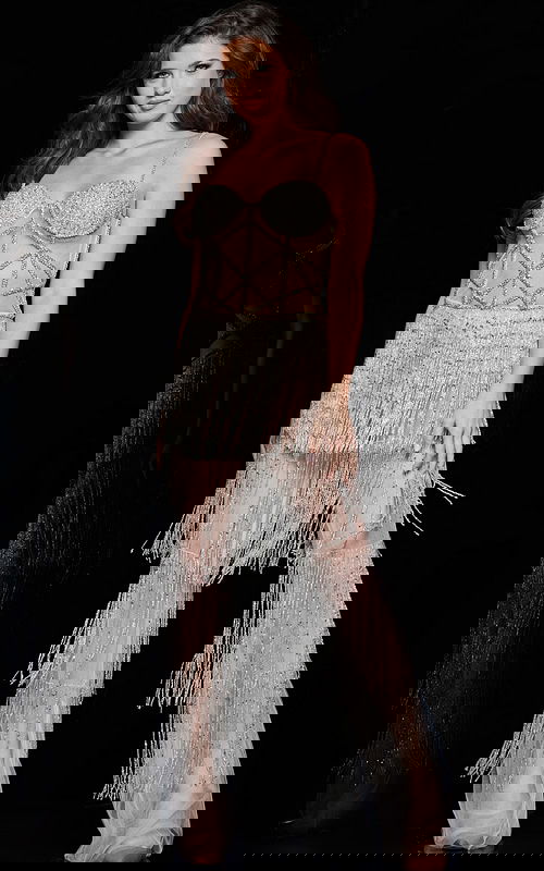 Model wearing Jovani 36424 nude dress with intricate beadwork and fringe in full view.