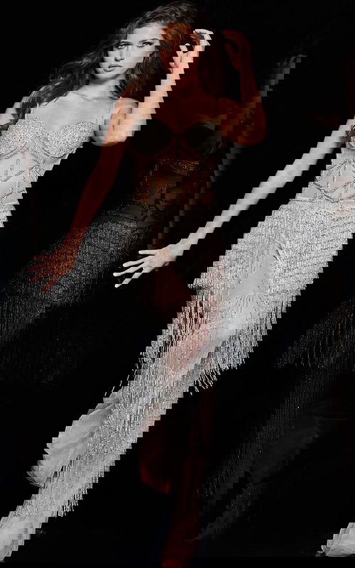 Model wearing Jovani 36424 nude dress showcasing the beadwork and fringe detail.