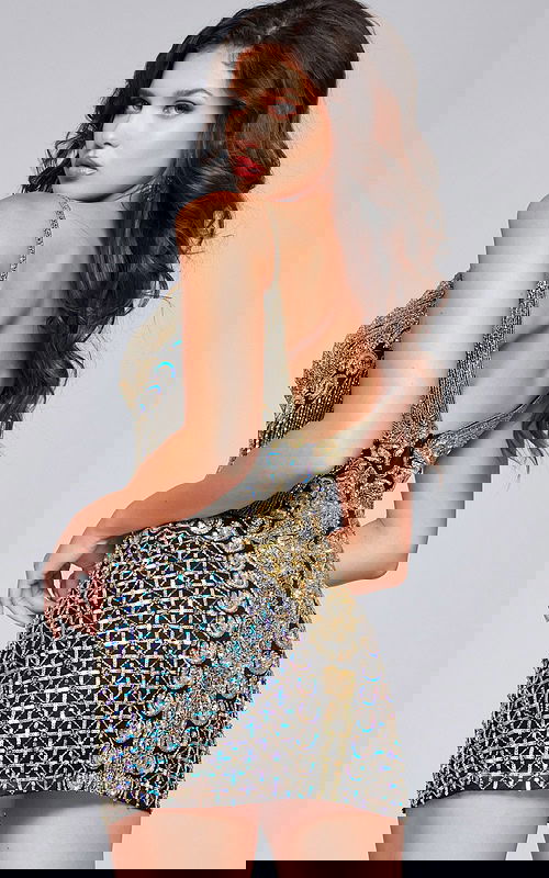 Model wearing Jovani 36425 black sequin cocktail dress, back view.