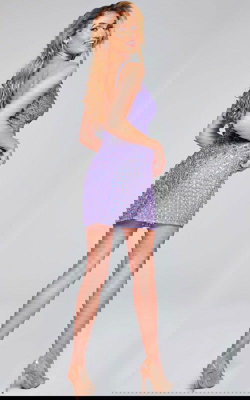 Model wearing Jovani 36425 in purple with V-neckline and intricate beadwork, back view.