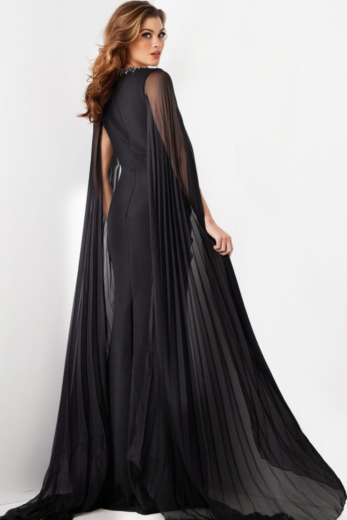 back view of model wearing Jovani 36473 elegant black gown with draped sleeves