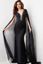 model wearing Jovani 36473 elegant black gown with deep V-neckline and draped sleeves