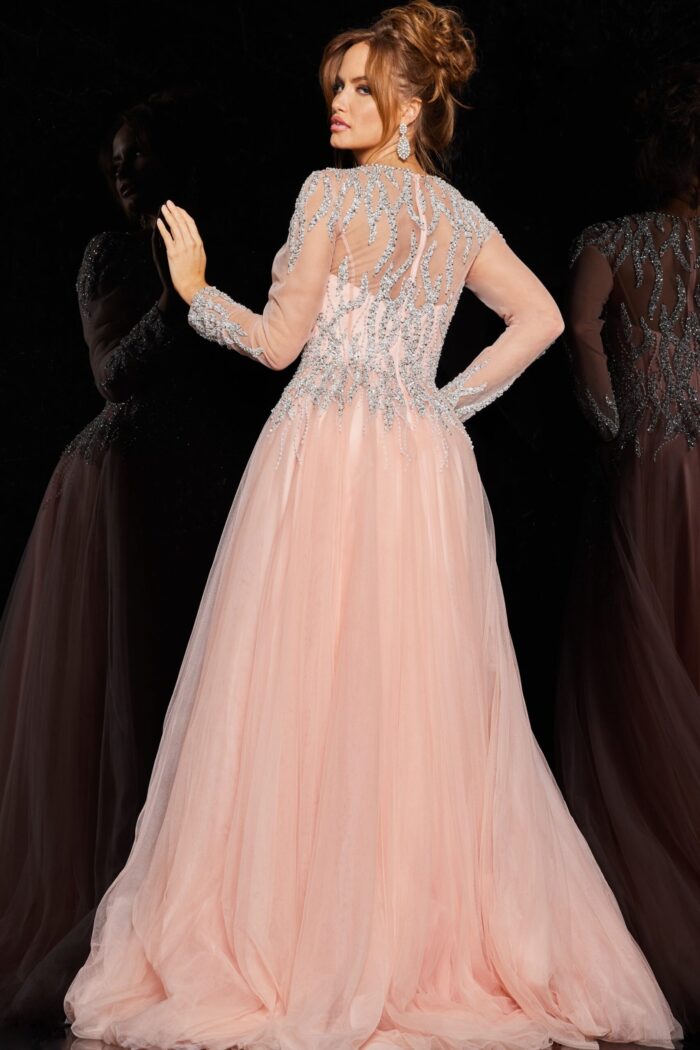 Back view of model in 36533 blush dress showcasing intricate beadwork.
