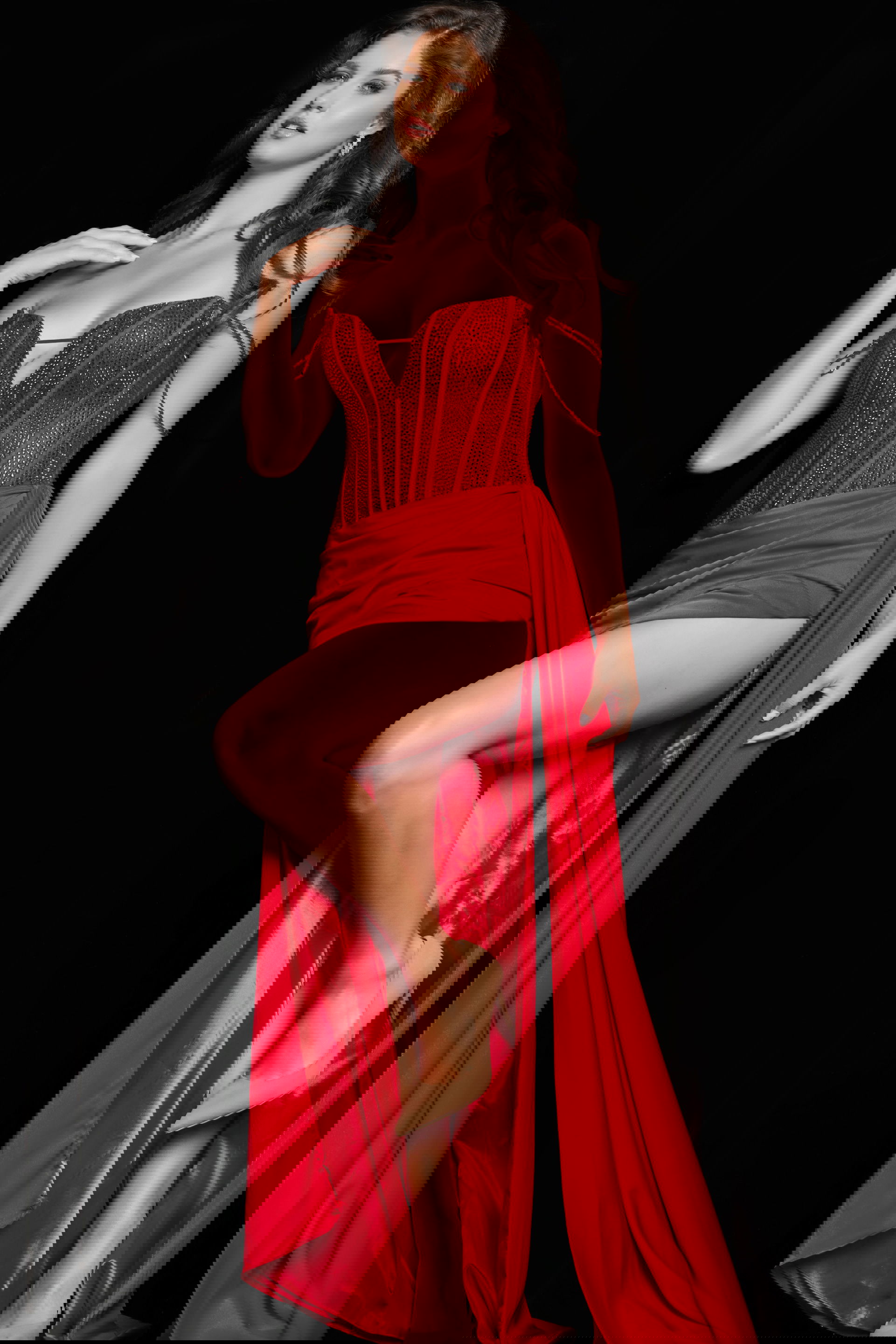 36538_RED_54-2.jpg Model wearing Jovani 36538 elegant red gown with bead embellishments and high slit.