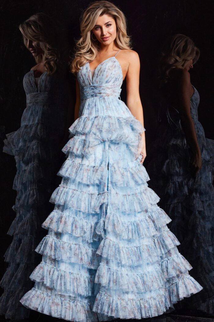 Model wearing Jovani 36571 blue ruffle dress highlighting the fitted bodice and high slit.