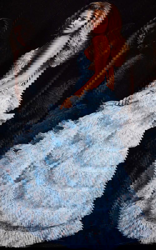 Back view of Jovani 36571 light blue gown showcasing ruffle detailing.