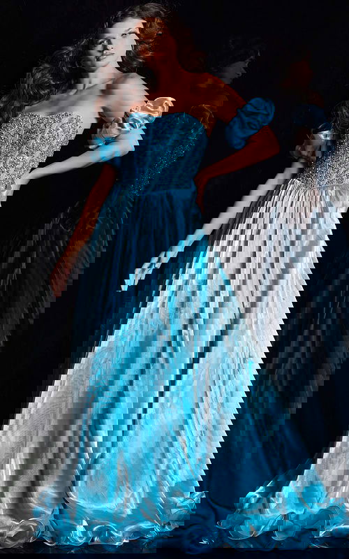 Model wearing Jovani 36591 blue ball gown with sweetheart neckline and off-the-shoulder puff sleeves, front view.