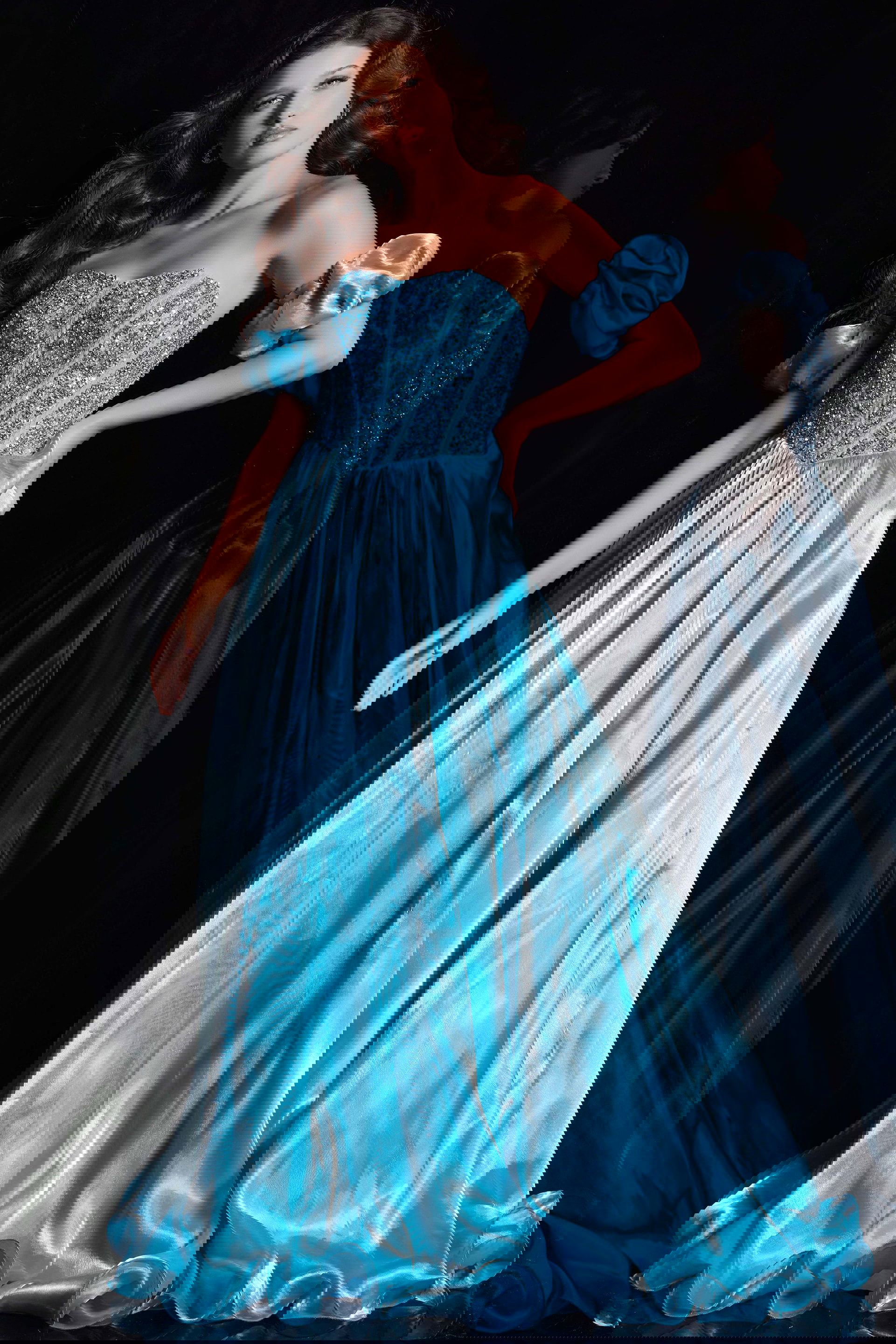 36591_11.jpg Model wearing Jovani 36591 blue ball gown with sweetheart neckline and off-the-shoulder puff sleeves, front view.