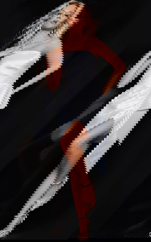 Model wearing Jovani 36596 ivory mini dress with asymmetric hem, front view