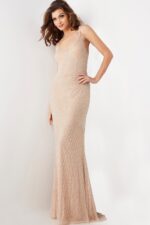 Model wearing Jovani 36609 nude gown with intricate beading, front view.