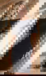 Jovani 36690 black structured mini dress with crew neckline, exaggerated shoulder short sleeves, and gold buckle strap detailing at the cuffs.