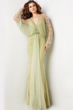 Model wearing 36744 green dress with V-neckline and beaded details