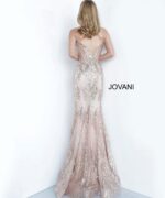 Model wearing Jovani 3675 rose gold mermaid gown with lace detailing, back view