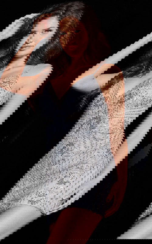 Model wearing Jovani 36786 Silver beaded dress V-neckline, spaghetti straps