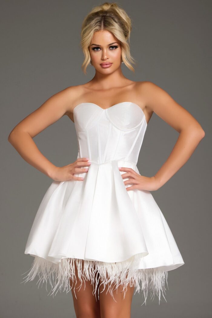 Model wearing 36979 white dress with sweetheart neckline featuring feathered hem.